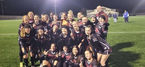 The Lady Eagles Girls Soccer team celebrates their hard-earned sectional win. Photo courtesy of: Ally Arthur